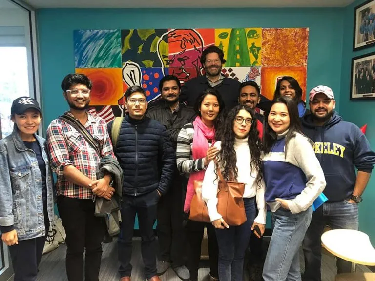 The fellows cohort with a U.S. host mentor during the placement.